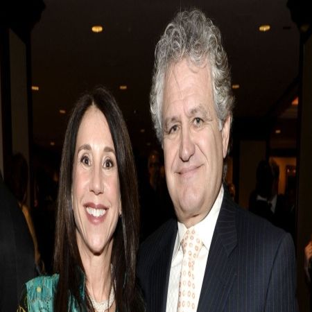 Sally and her spouse, Anthony posing for a picture